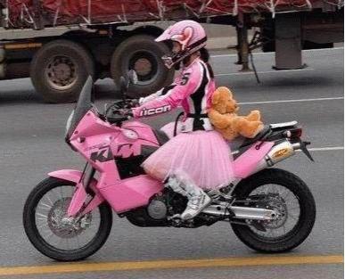 woman in pink on motorcycle